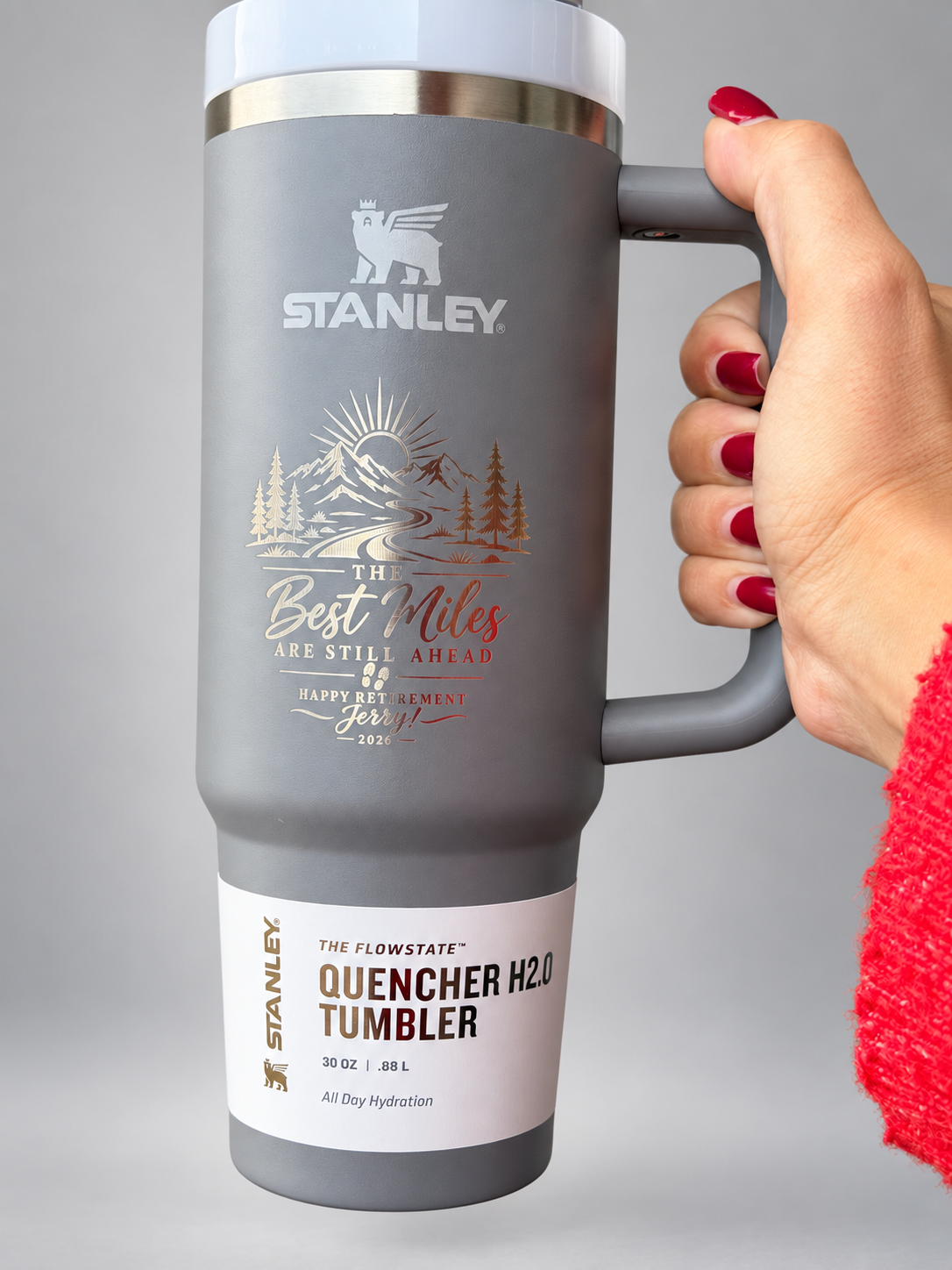 Custom laser-engraved gray Stanley tumbler on a neutral studio background