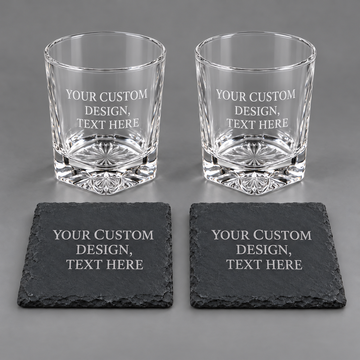 Illustrative set of two glasses and two coasters engraved YOUR CUSTOM DESIGN, TEXT HERE