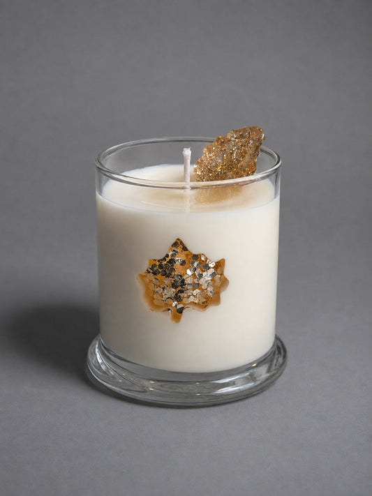 Golden Autumn Maple Leaf candle on a grey background