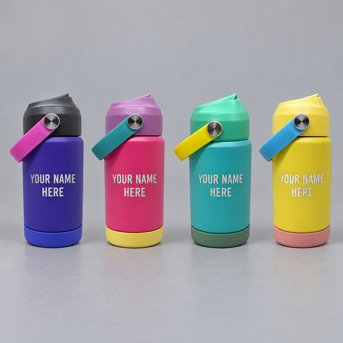 Illustrative purple, pink, teal and yellow kids’ flip-top cups with YOUR NAME HERE engraving on a gray background