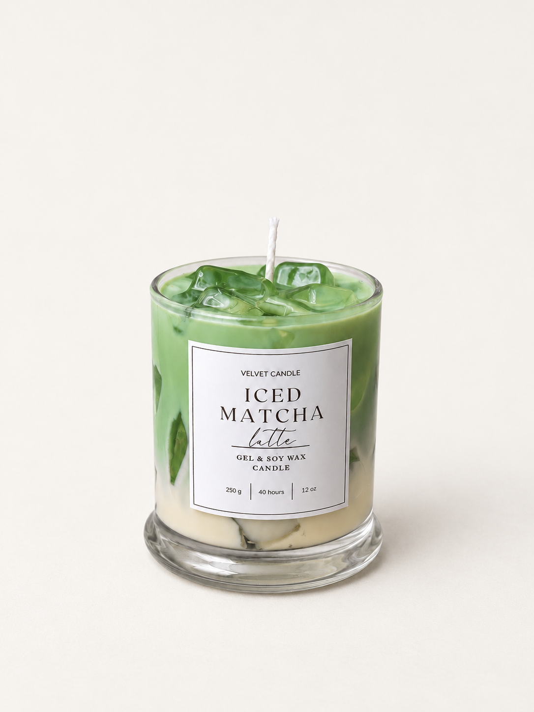 Green Iced Matcha Latte candle with translucent wax ice in a labeled clear glass