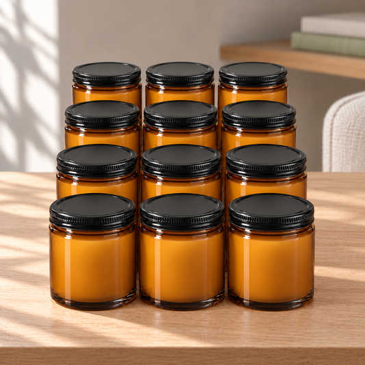 Custom Label 8 oz Bulk Amber Soy Candles with Black Lids — 12, 24 or 48 Pack on a straight pale oak table in natural daylight