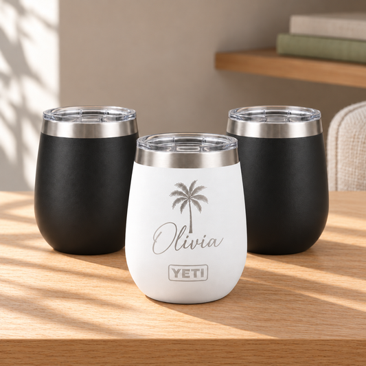 Personalized Wine Tumbler — YETI 10 oz or Polar Camel 12 oz on a straight pale oak table in natural daylight