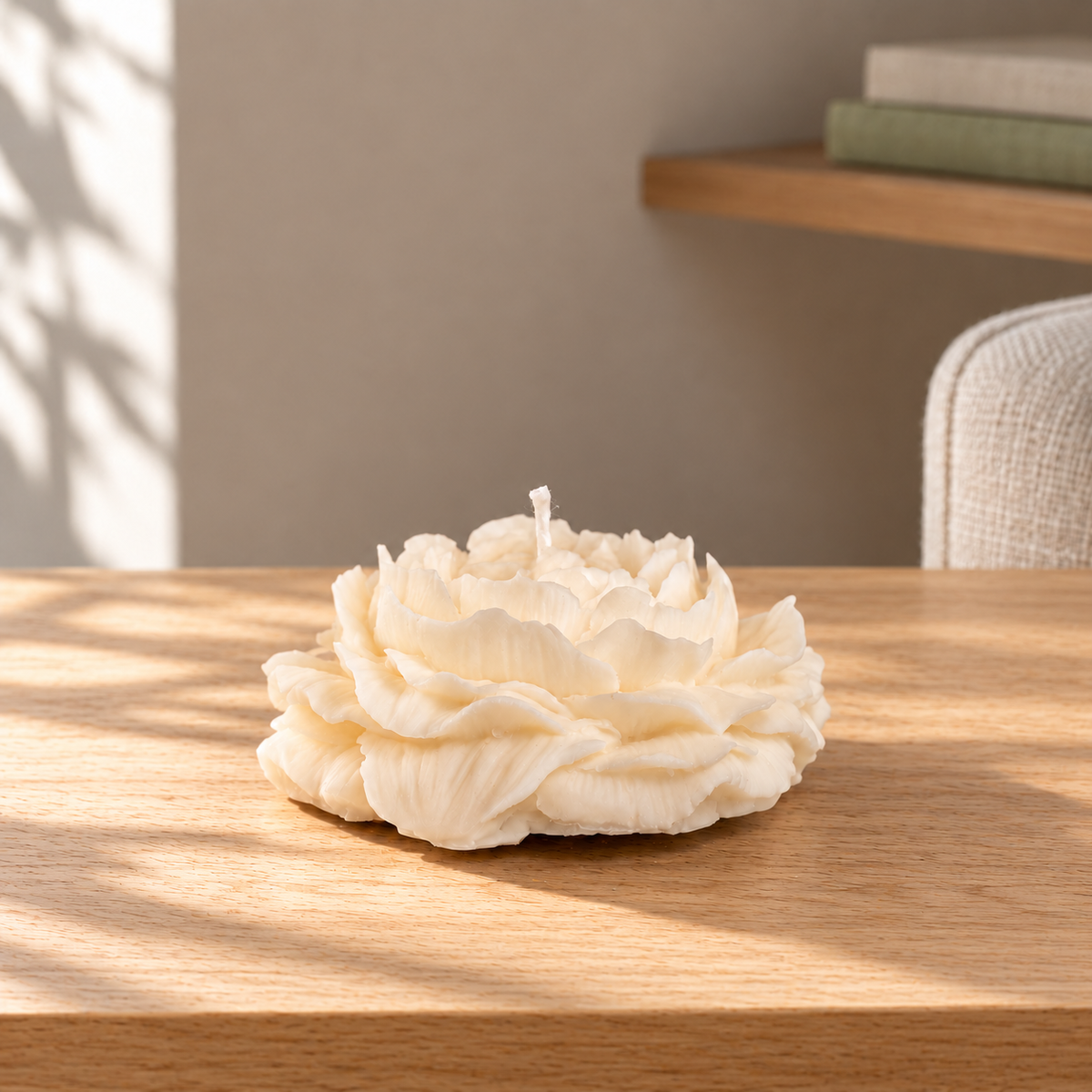 Peony Soy Wax Candle on a straight pale oak table in natural daylight