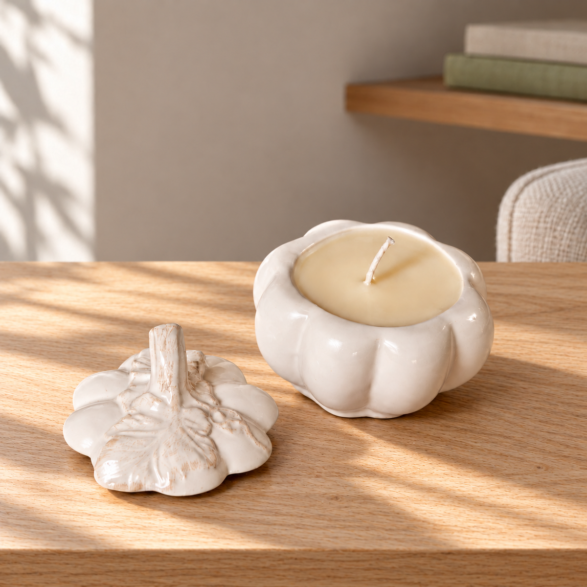 Harvest Pumpkin (White) Soy Wax Candle on a straight pale oak table in natural daylight