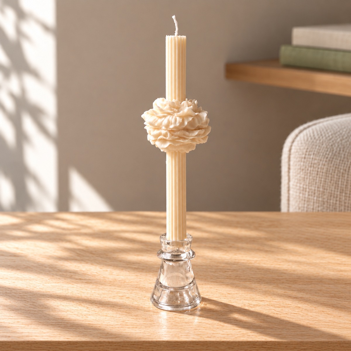 Bloom Taper Candle on a straight pale oak table in natural daylight