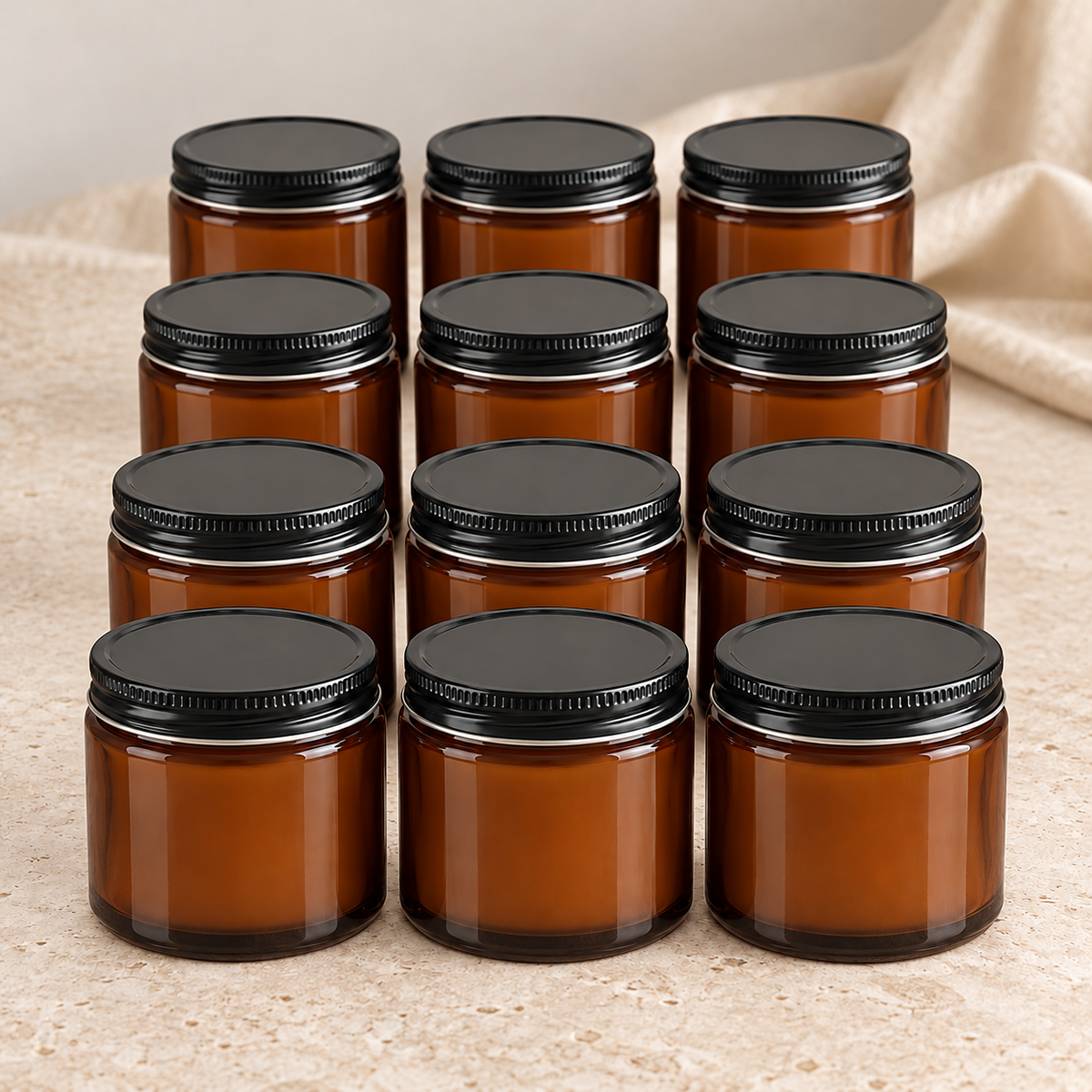 Supplier-referenced product mockup of twelve compact 4 fl oz deep brown amber soy candles with black metal lids